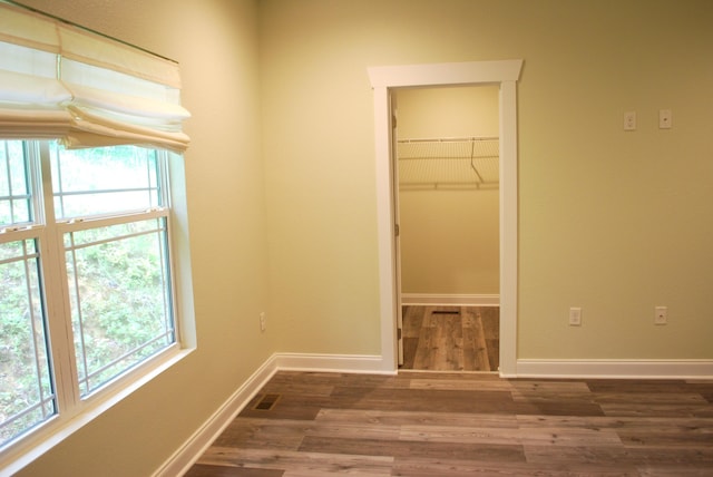 interior space featuring a wealth of natural light and dark hardwood / wood-style flooring