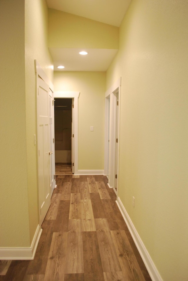 corridor featuring hardwood / wood-style floors