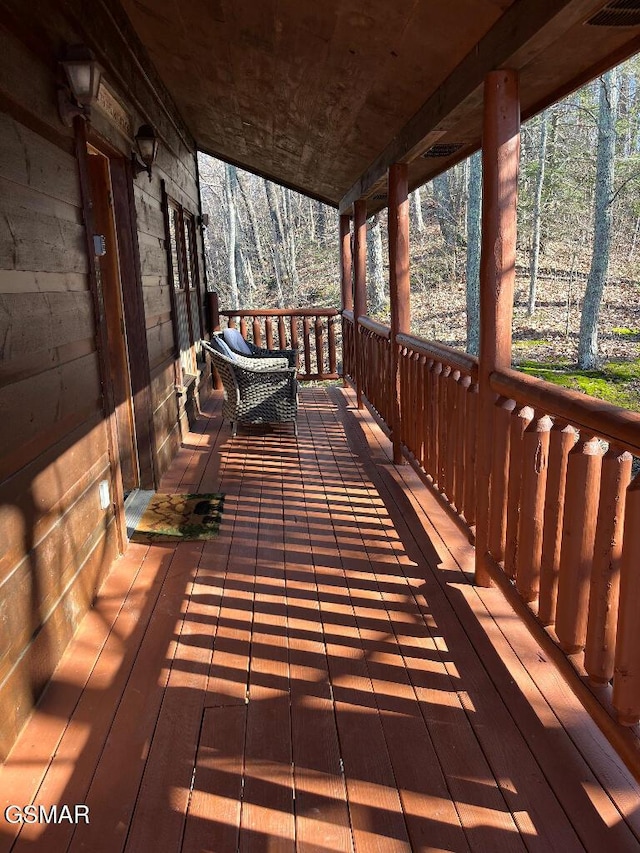 wooden deck featuring covered porch