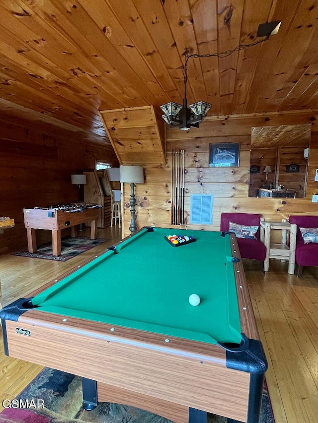 recreation room with wooden walls, wooden ceiling, hardwood / wood-style flooring, and billiards