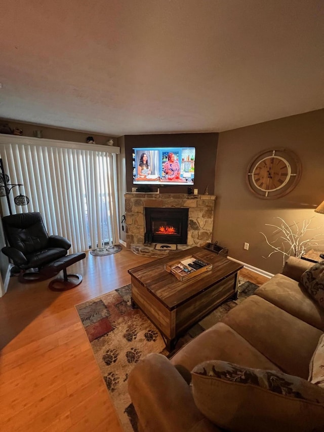 living room featuring hardwood / wood-style floors and a fireplace