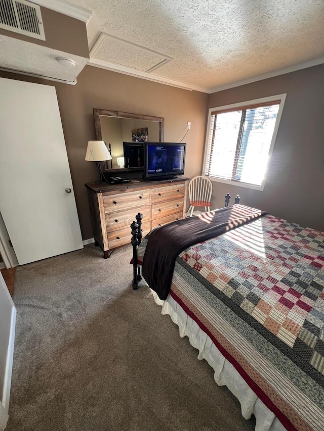 carpeted bedroom featuring crown molding and a textured ceiling