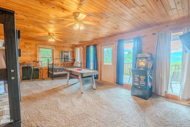 1910 E Mountain View Way, Sevierville, TN 37876 - recreation room featuring carpet floors, a ceiling fan, wood ceiling, and wood walls