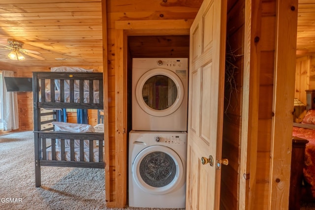1910 E Mountain View Way, Sevierville, TN 37876 - washroom featuring estacked washer and dryer, carpet floors, wooden walls, a ceiling fan, and wood ceiling