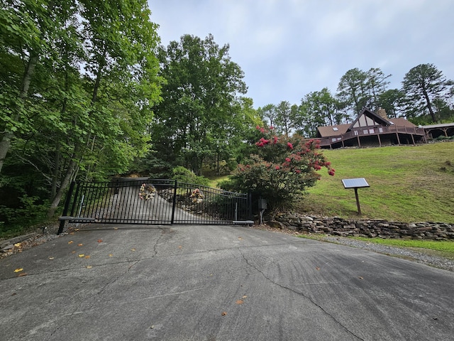 view of gate featuring a yard