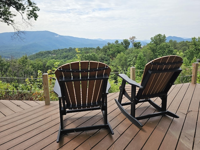 wooden deck featuring a mountain view