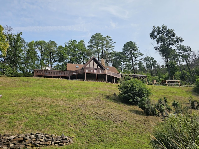 view of yard featuring a rural view and a deck