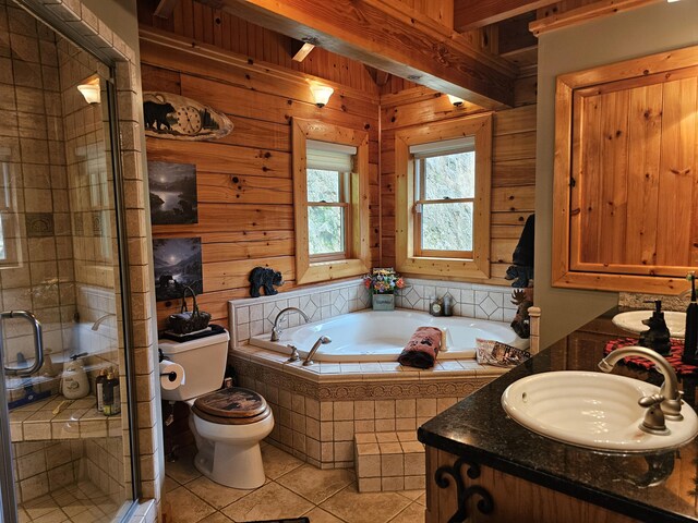 full bathroom with tile patterned flooring, vanity, wood walls, and toilet