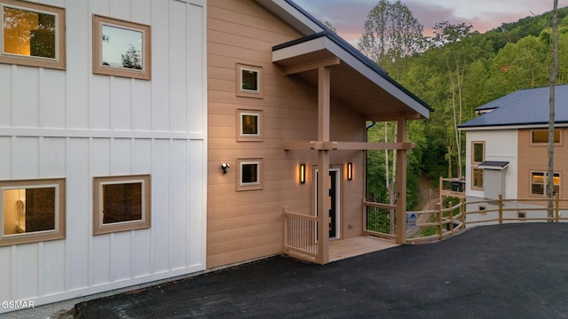 1928 Pine Ct, Sevierville, TN 37876 - exterior entry at dusk featuring board and batten siding