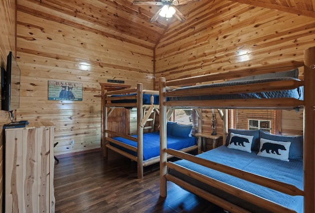 bedroom with ceiling fan, wooden ceiling, dark hardwood / wood-style flooring, high vaulted ceiling, and wooden walls