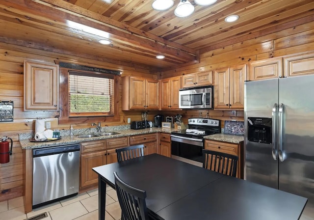 kitchen with sink, light tile patterned floors, light stone counters, wood ceiling, and stainless steel appliances