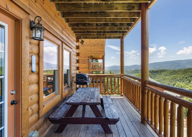 deck featuring a mountain view and area for grilling