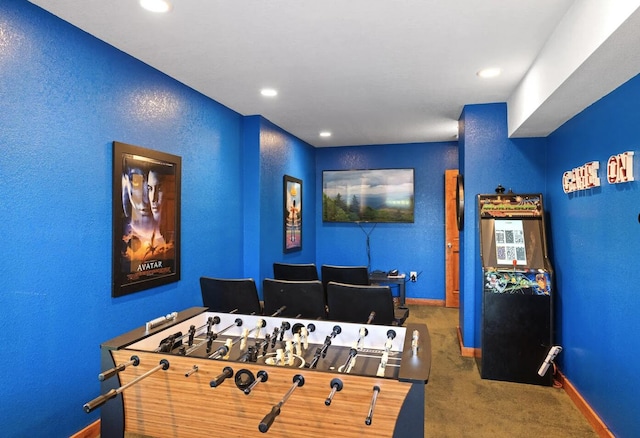 recreation room with carpet flooring