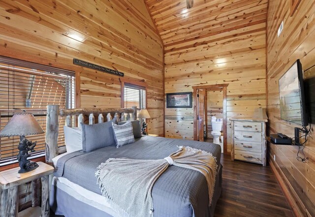 bedroom with wooden walls, dark hardwood / wood-style flooring, and high vaulted ceiling