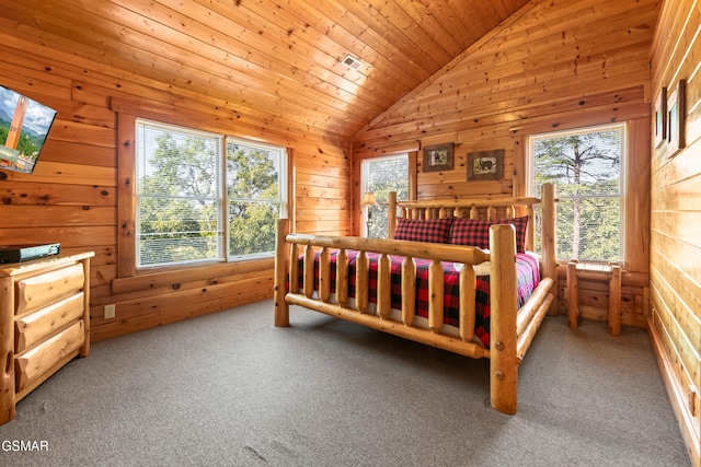 carpeted bedroom featuring wooden walls, vaulted ceiling with skylight, and wood ceiling