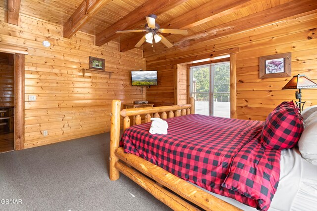 bedroom with wood ceiling, access to outside, ceiling fan, wooden walls, and beam ceiling