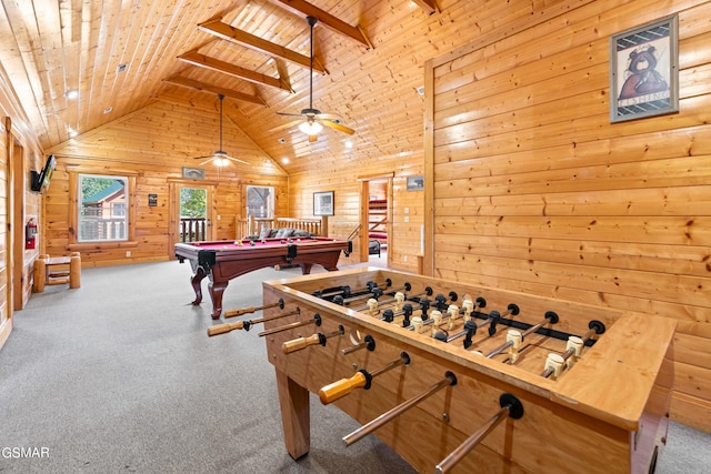 playroom with ceiling fan, beamed ceiling, high vaulted ceiling, wood walls, and wood ceiling