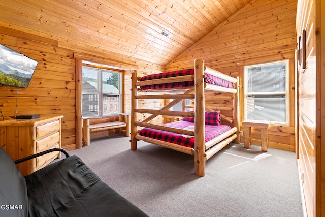 carpeted bedroom with wooden walls, wood ceiling, and lofted ceiling