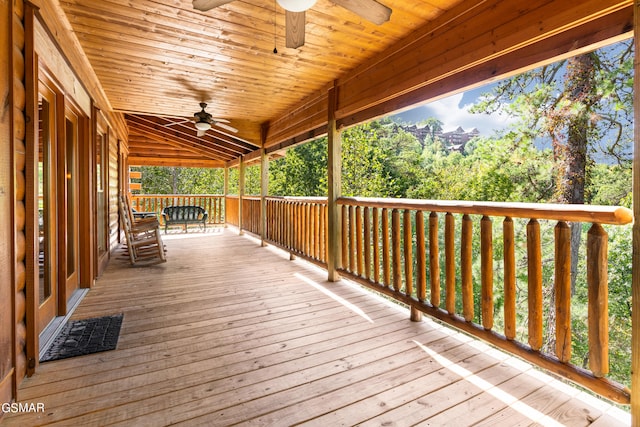 wooden deck featuring ceiling fan