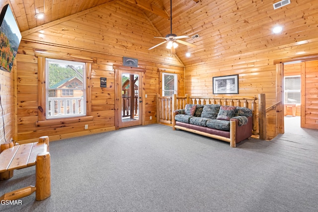 living room featuring wooden ceiling, high vaulted ceiling, wooden walls, ceiling fan, and carpet floors