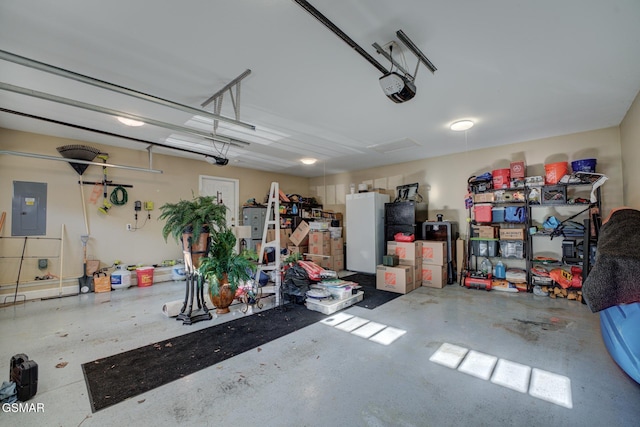 garage featuring a garage door opener and electric panel