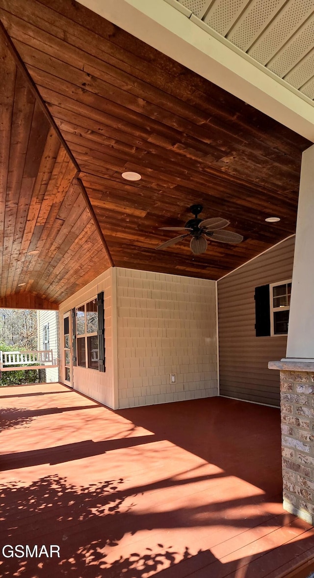 exterior space with ceiling fan