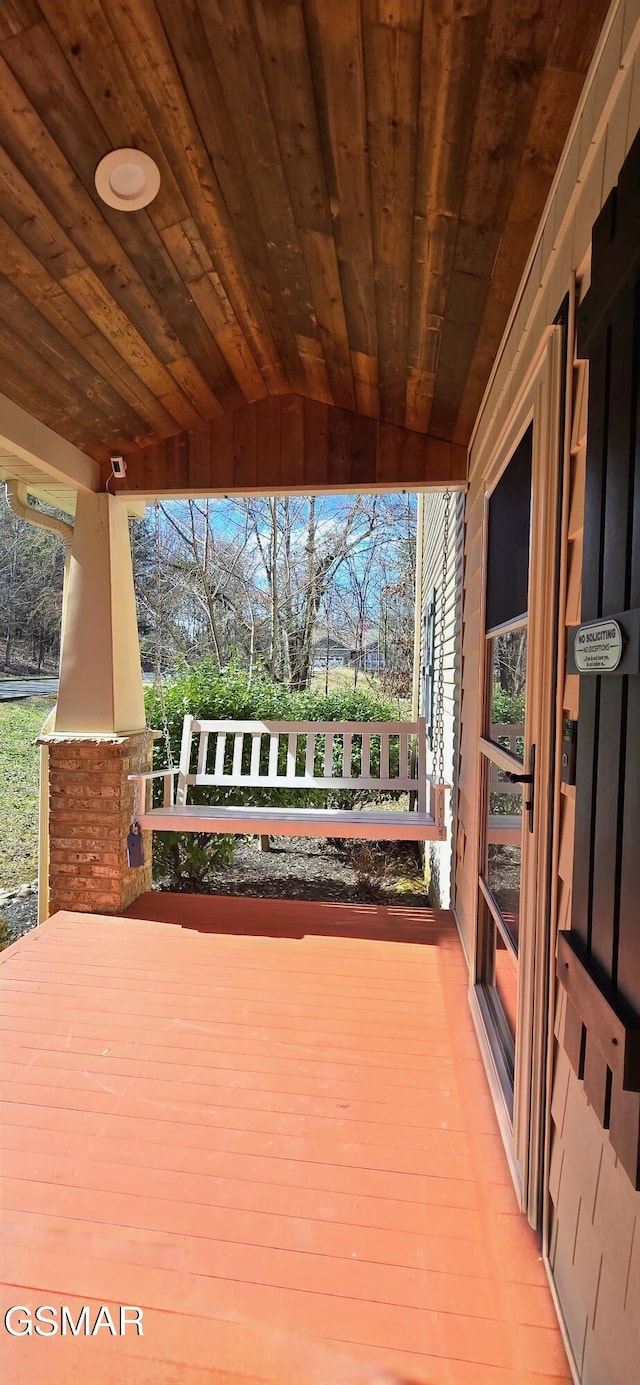 wooden terrace featuring a porch