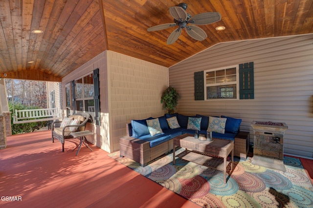 view of patio with ceiling fan, a wooden deck, and an outdoor hangout area