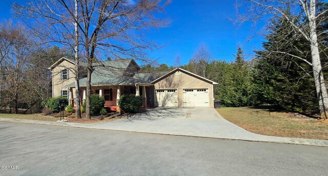 view of front of home featuring driveway and an attached garage