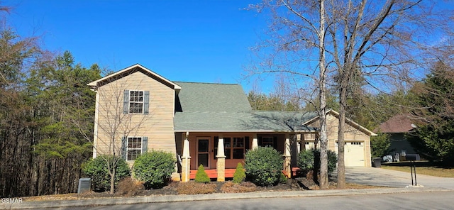 view of front of property with an attached garage and concrete driveway