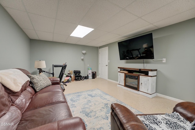 living room with a paneled ceiling