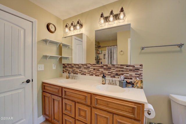 bathroom featuring toilet, vanity, decorative backsplash, and curtained shower