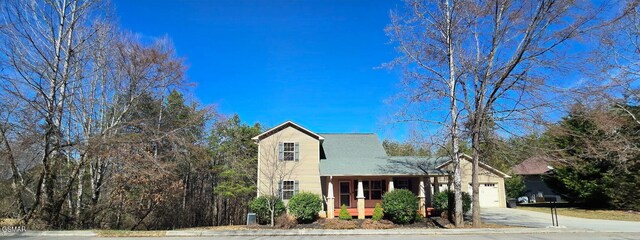 view of front of home featuring a garage and covered porch