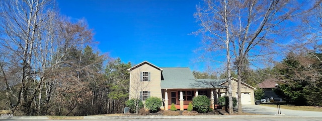 view of front facade featuring driveway and an attached garage