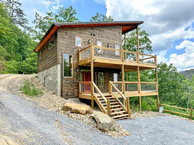 view of front of home with a wooden deck