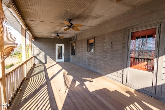 wooden deck with ceiling fan