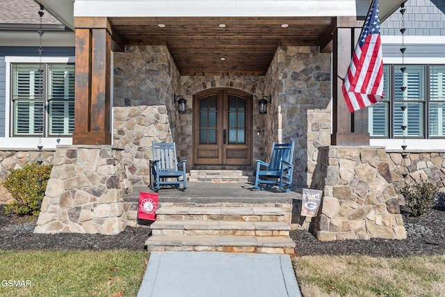 view of exterior entry featuring a porch