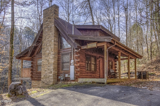 view of side of property featuring a porch