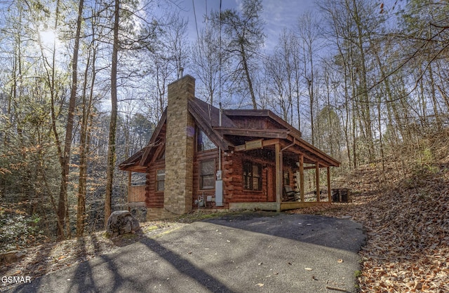 view of side of home with a porch