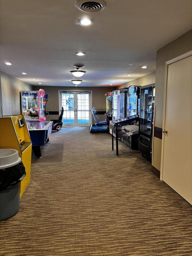 interior space with french doors and dark colored carpet