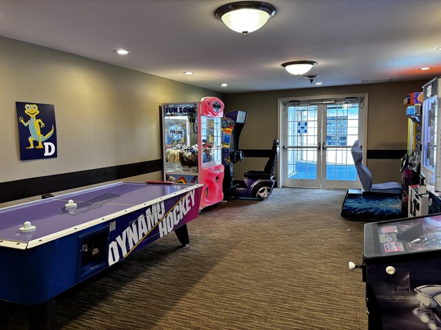 game room featuring dark colored carpet and french doors