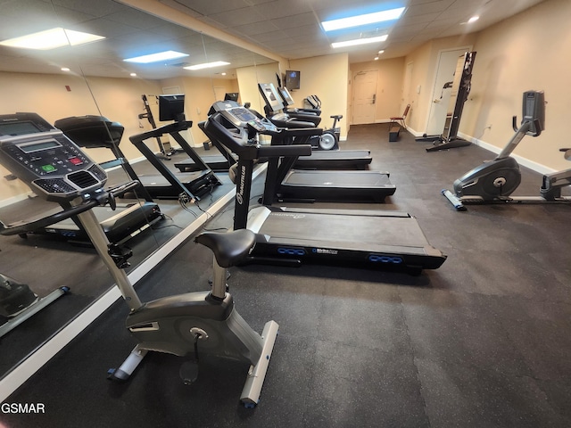 workout area with a paneled ceiling