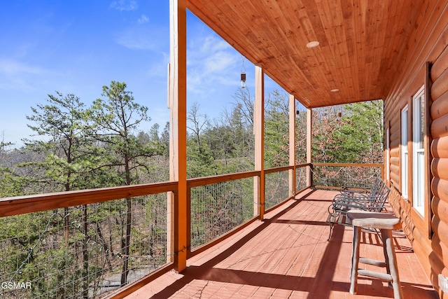 unfurnished sunroom featuring wooden ceiling