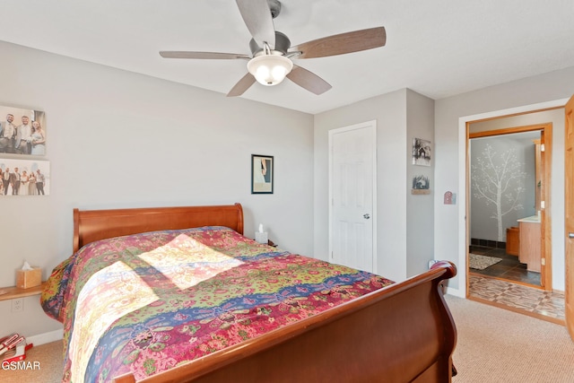 carpeted bedroom with a ceiling fan and baseboards