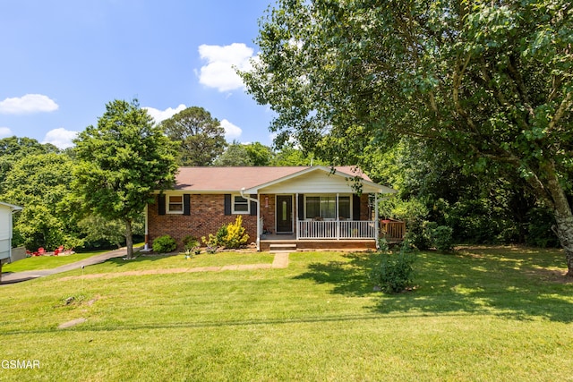 6119 Ridgeview Rd, Knoxville, TN 37918 - view of front of house with brick siding, a front lawn, and covered porch