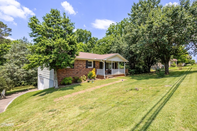 6119 Ridgeview Rd, Knoxville, TN 37918 - view of front of home featuring covered porch, an attached garage, a front lawn, driveway, and brick siding