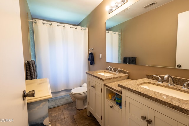 6119 Ridgeview Rd, Knoxville, TN 37918 - bathroom featuring toilet, vanity, and stone finish flooring