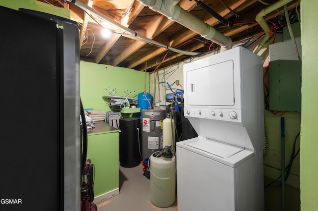 laundry room featuring electric water heater, stacked washer and clothes dryer, and electric panel