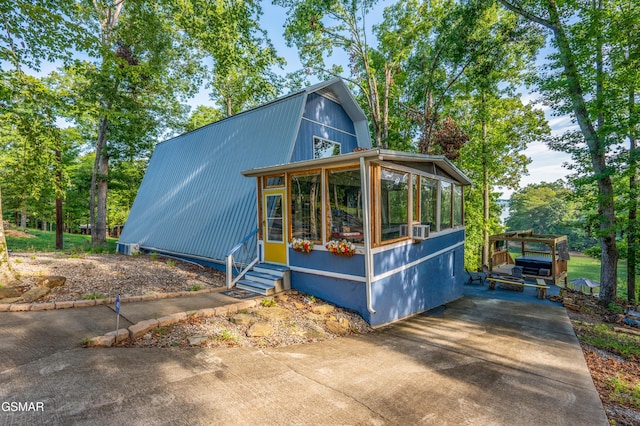 exterior space featuring a sunroom