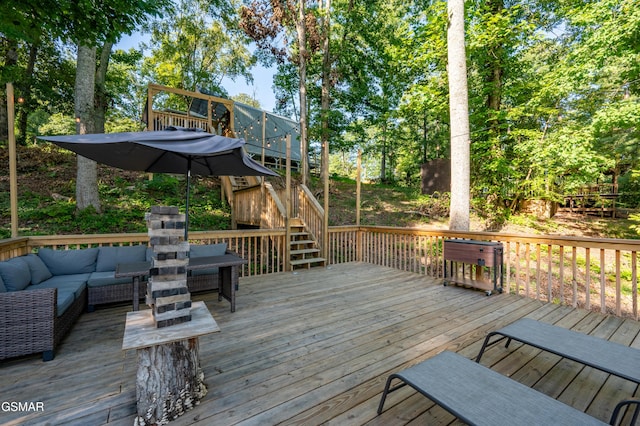 wooden terrace featuring an outdoor living space